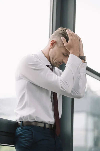 Sad Businessman Touching Hair While Standing Windows — Stock Photo, Image