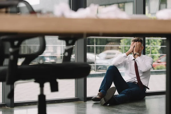 Selective Focus Man Covering Face Hands While Sitting Floor Workplace Stock Picture