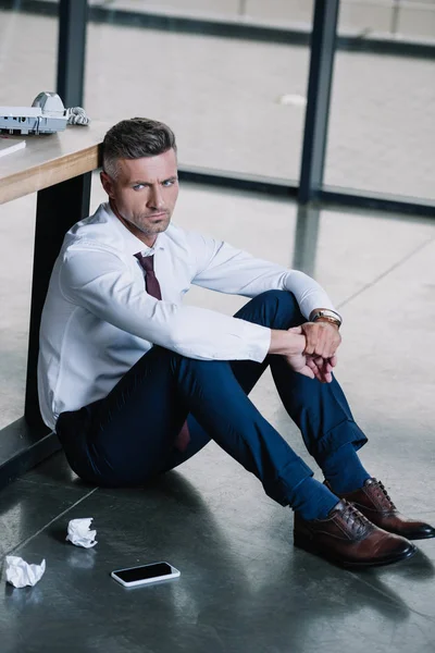 Upset Businessman Sitting Floor Smartphone Blank Screen Stock Picture