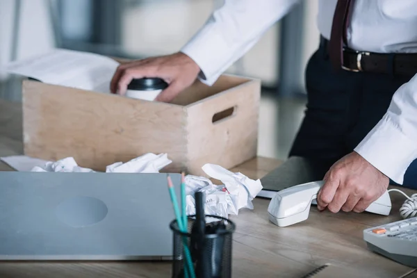 Cropped View Man Holding Paper Cup Wooden Box Crumpled Paper Stock Image