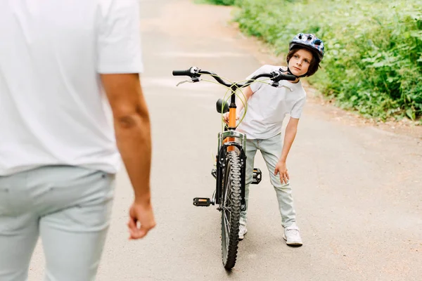Selective Focus Boy Touching Knee While Father Standing Son — Stock Photo, Image
