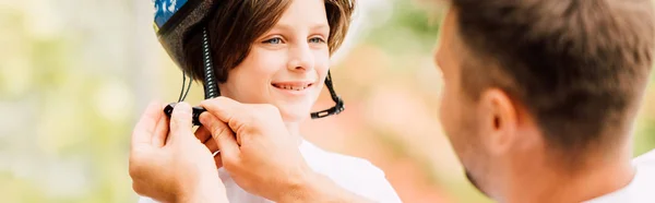 Panoramic Shot Son Smiling Looking Dad While Father Putting Helmet — Stock Photo, Image