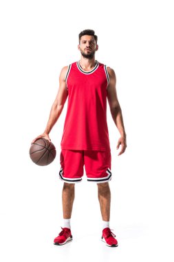 handsome athletic basketball player in red uniform with ball Isolated On White  clipart