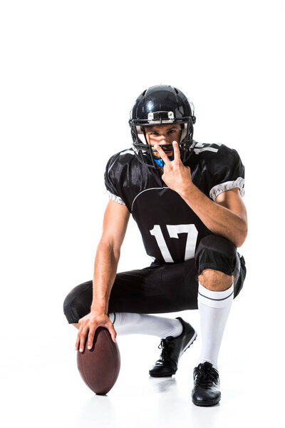 American Football player with ball showing peace sign On White