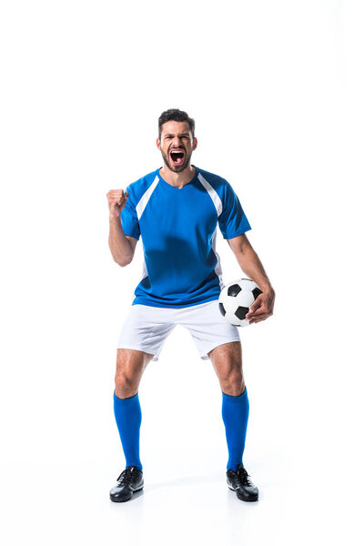 excited soccer player with ball and clenched hand yelling Isolated On White
