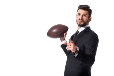 Rugby topu ile resmi aşınmasında işadamı parmak ile işaret beyaz üzerinde Izole