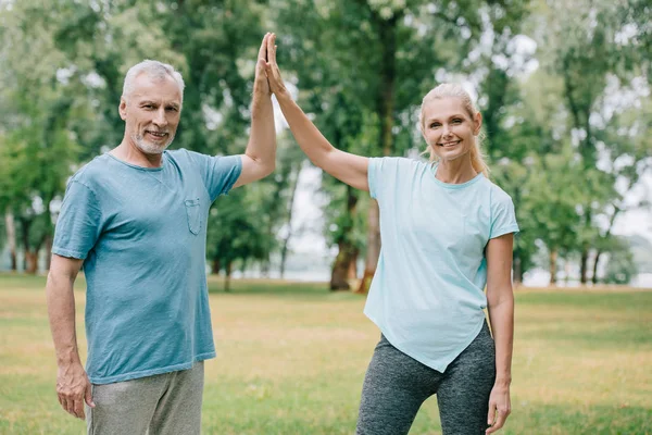 Cheerful Sportsman Sportswoman Giving High Five While Smiling Camera — Stock Photo, Image