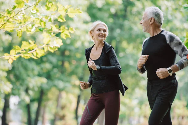 Cheerful Sportswoman Jogging Park Together Mature Sportsman — Stock Photo, Image