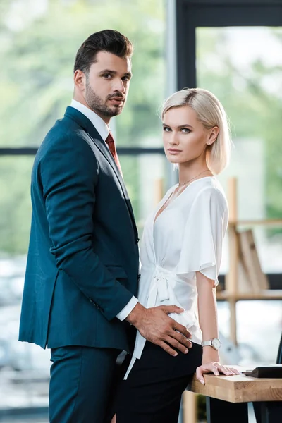 Handsome Bearded Man Touching Attractive Woman While Looking Camera — Stock Photo, Image