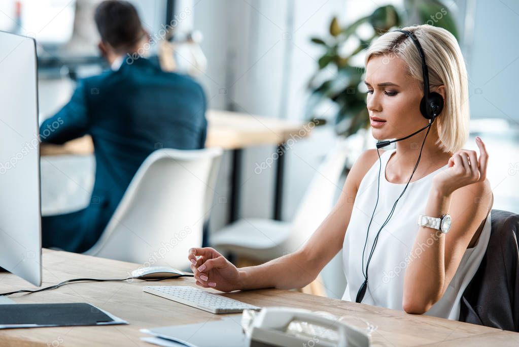 selective focus of attractive operator in headset working in office 
