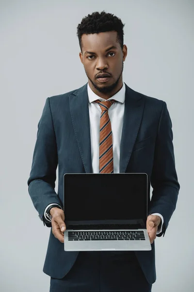 Handsome African American Man Holding Laptop Blank Screen Isolated Grey — Stock Photo, Image