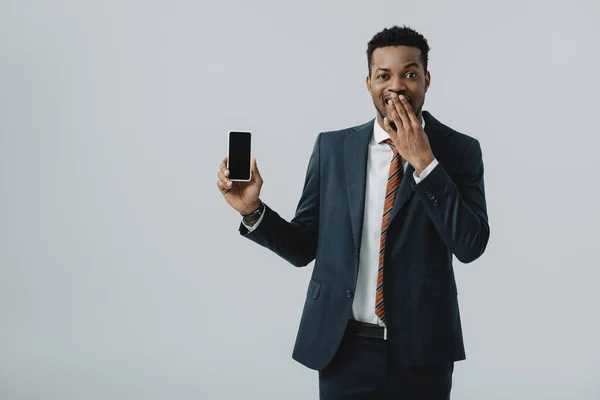 African American Businessman Covering Face Holding Smartphone Blank Screen Isolated — Stock Photo, Image