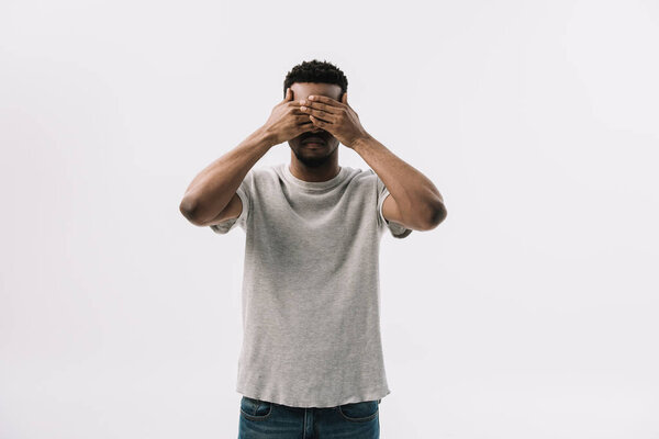 african american man covering eyes isolated on white  