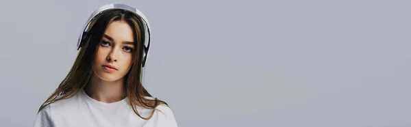 Panoramic Shot Serious Pretty Girl Listening Music Wireless Headphones Isolated — Stock Photo, Image