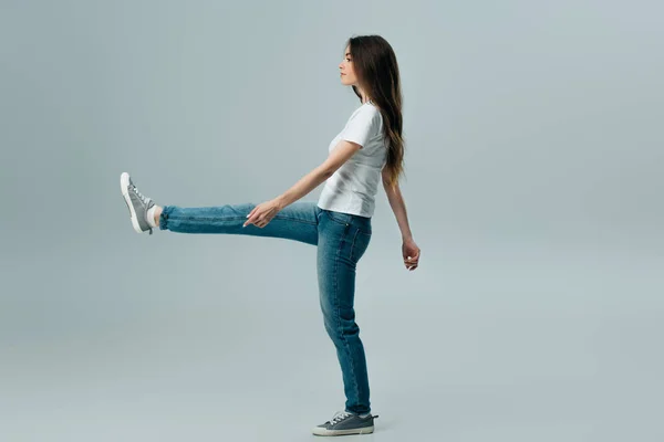 stock image full length view of pretty girl marching isolated on grey