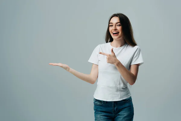 Beautiful Excited Girl Pointing Hand Finger Copy Space Isolated Grey — Stock Photo, Image