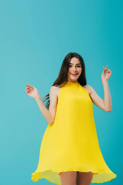 Happy Beautiful Girl Yellow Dress Spinning Isolated Turquoise — Stock Photo, Image