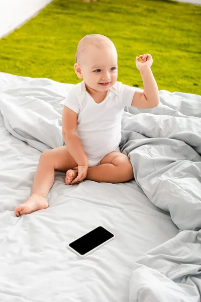 Adorable Little Child Sitting Bed Digital Device Raising Hand — Stock Photo, Image
