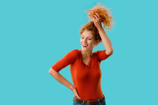 Beautiful Smiling Girl Holding Red Curly Hair Isolated Blue — Stock Photo, Image
