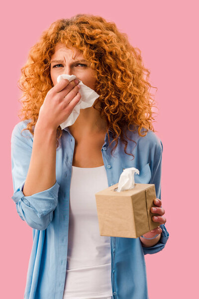 beautiful woman crying with paper napkins, Isolated On pink