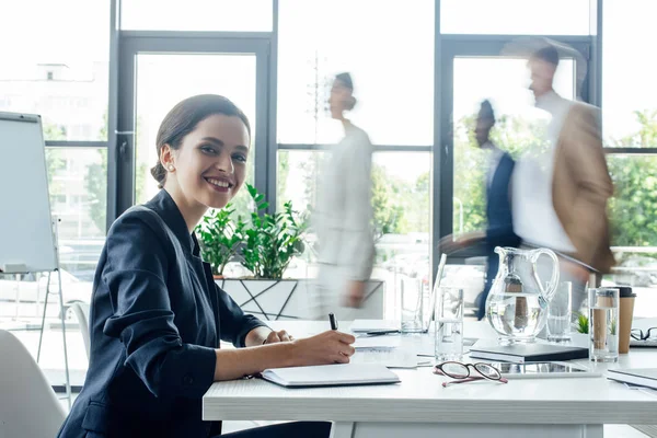 Smiling Attractive Businesswoman Writing Notebook Pen — Stock Photo, Image