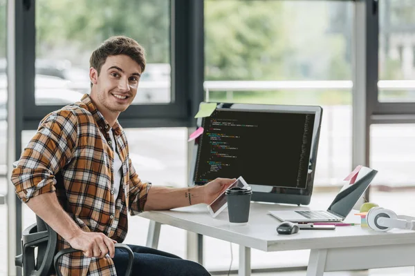 Cheerful Programmer Smiling Camera While Sitting Computer Monitor Script Screen — Stock Photo, Image