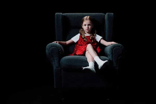 Lonely Child Sitting Armchair Looking Camera Isolated Black — Stock Photo, Image