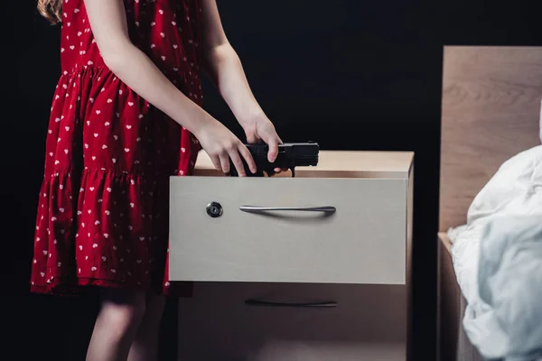 Partial View Child Taking Gun Out Nightstand Isolated Black — Stock Photo, Image