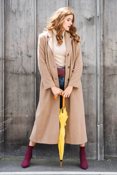 Attractive Woman Closed Eyes Coat Holding Yellow Umbrella — Stock Photo, Image