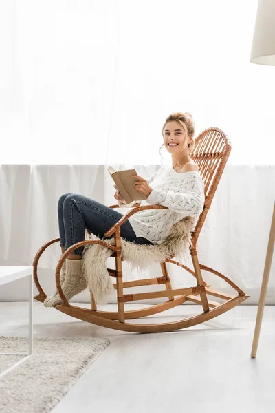 Attractive Woman White Sweater Sitting Rocking Chair Holding Book — Stock Photo, Image