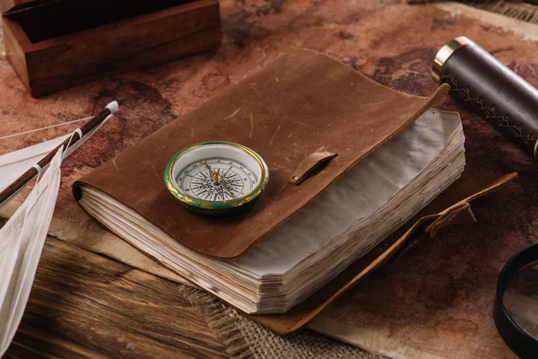 Brown Leather Notebook Compass Wooden Surface World Map — Stock Photo, Image