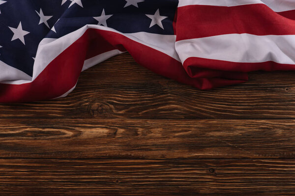 top view of American national flag on wooden surface