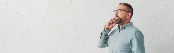 Panoramic Shot Handsome Businessman Glasses Talking Smartphone — Stock Photo, Image
