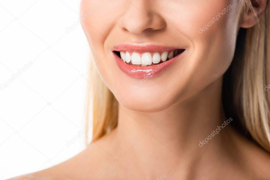 partial view of smiling blonde woman with white teeth isolated on white