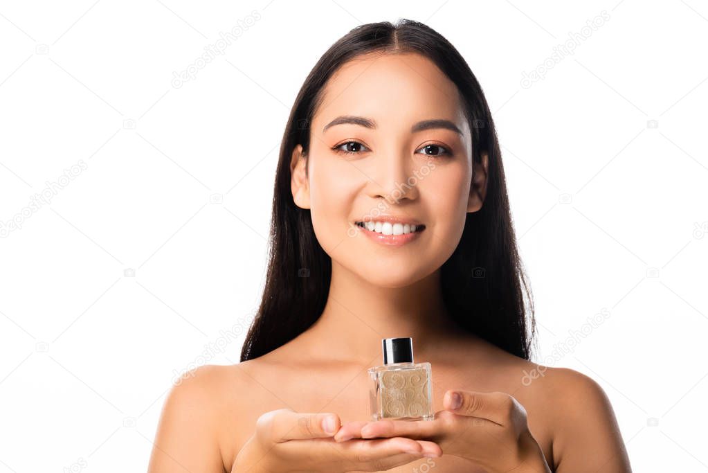 naked beautiful asian woman holding perfume isolated on white