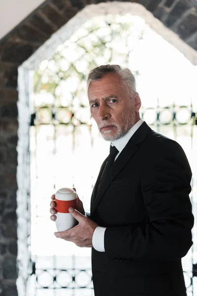 Upset Bearded Elderly Man Holding Mortuary Urn — Stock Photo, Image