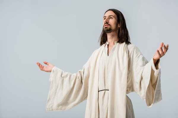 man in jesus robe with outstretched hands isolated on grey
