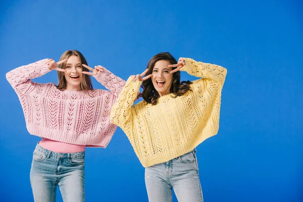 Attractive Smiling Women Sweaters Showing Victory Signs Isolated Blue — Stock Photo, Image