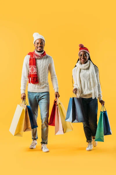 African American Couple Winter Outfit Walking Shopping Bags Isolated Yellow — Stock Photo, Image