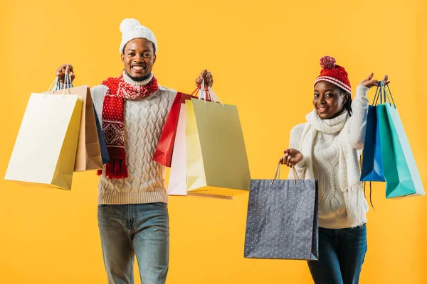 African American Couple Winter Outfit Shopping Bags Isolated Yellow — Stock Photo, Image