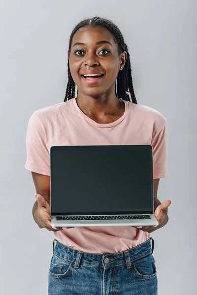 African American Woman Smiling Holding Laptop Blank Screen Isolated Grey — Stock Photo, Image