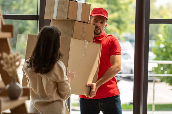 Selective Focus Handsome Delivery Man Holding Carton Boxes Woman Home — Stock Photo, Image