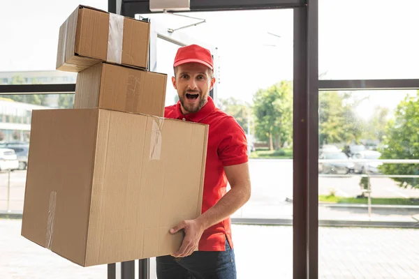 Surprised Bearded Man Holding Carton Boxes While Looking Camera — Stock Photo, Image