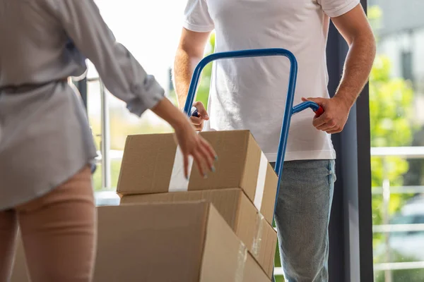 Cropped View Delivery Man Holding Delivery Cart Boxes Woman — Stock Photo, Image