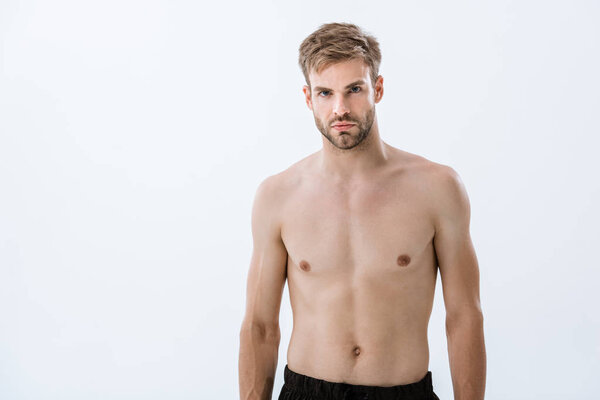 bearded shirtless sportsman looking at camera isolated on grey