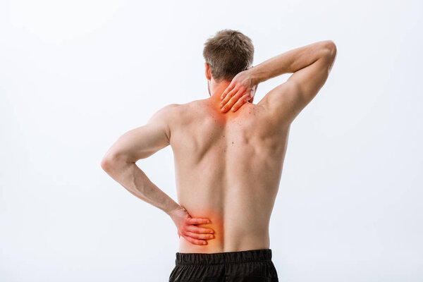 back view of shirtless sportsman with neck pain and backache isolated on grey