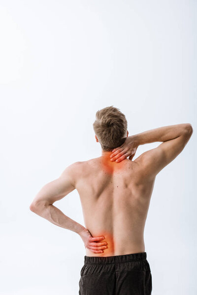 back view of shirtless sportsman with neck pain and backache isolated on grey