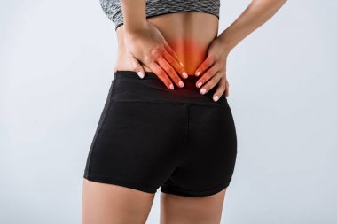 gri izole alt sırt ağrısı ile sporcu kısmi görünümü