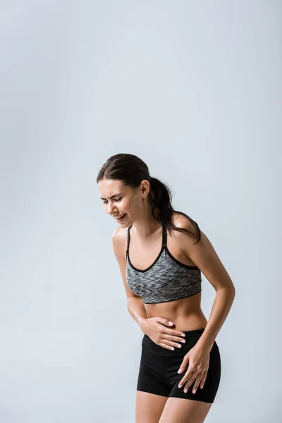 Attractive Sportswoman Stomach Pain Isolated Grey — Stock Photo, Image