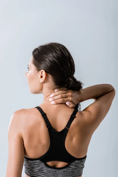 Back View Sportswoman Neck Pain Isolated Grey — Stock Photo, Image